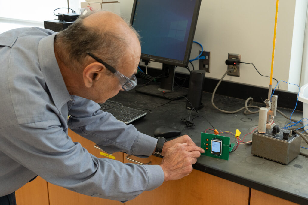 Photo of Prof. Poppiti working on a thermocouple