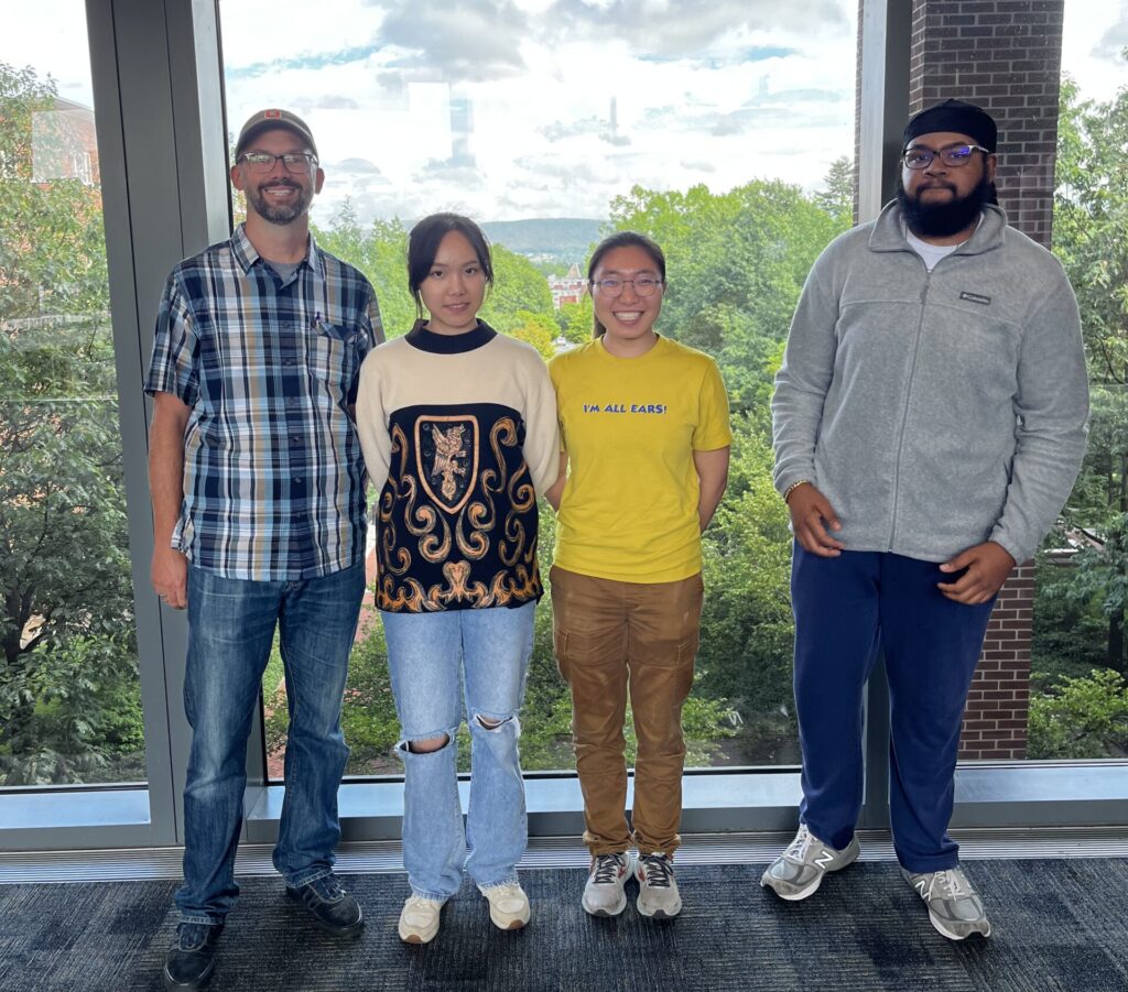 Photo of Prof. Thompson with summer researchers, Ziang Wang, Hana Konno and Isaiah Lares